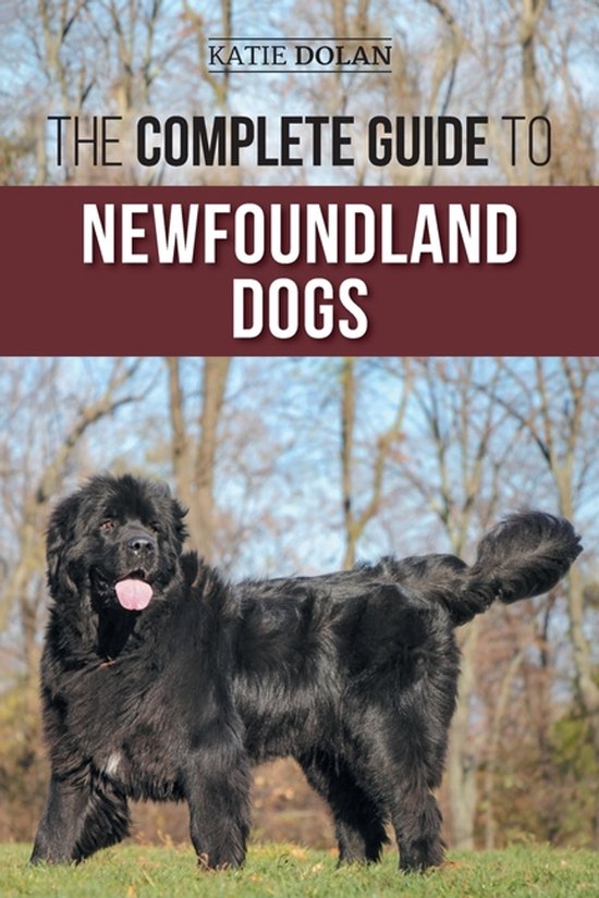 Boek "The Complete Guide to Newfoundland Dogs" met een zwarte Newfoundlander hond in de buitenlucht.