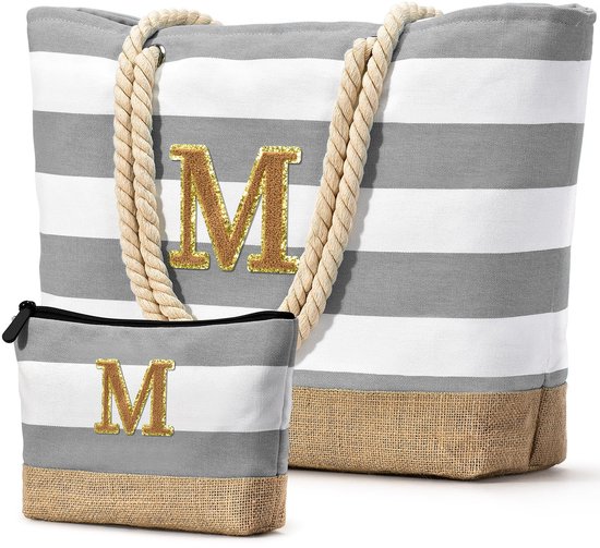 Sac de plage rayé avec M doré et trousse assortie.