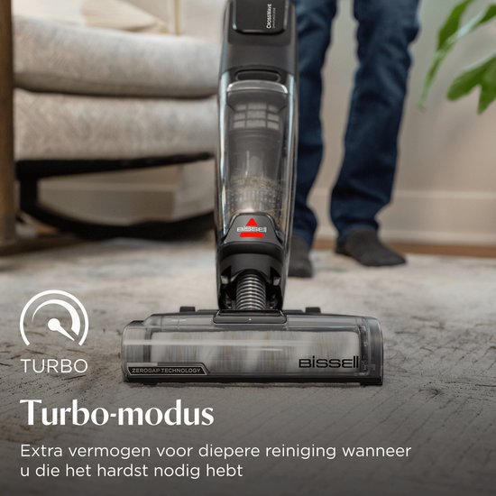 Zwarte BISSELL CrossWave stofzuiger in turbomodus op een grijs tapijt.