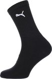 Een zwarte sportsok met wit Puma-logo op de schacht.