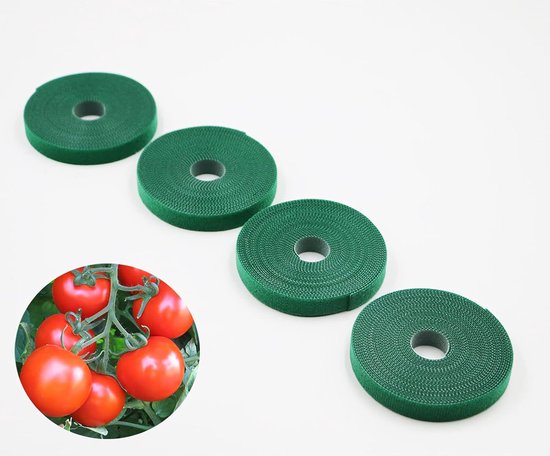 Vier rollen groen klittenband naast een detail van tomaten aan een struik.