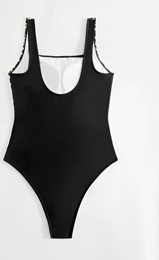 Dos d'un maillot de bain noir avec imprimé léopard sur les bretelles.