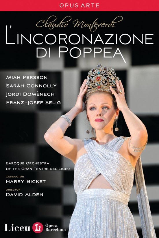 Miah Persson als Poppea draagt een kroon en zilveren jurk.