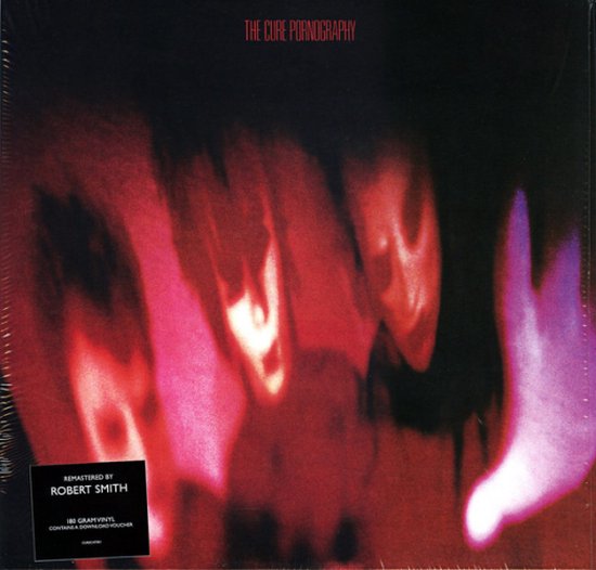 Albumhoes van The Cure Pornography, met rode en paarse abstracte vormen.