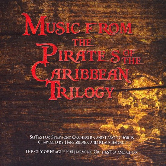 Albumhoes met de titel "Music from the Pirates of the Caribbean Trilogy" in rode letters op een houten achtergrond.