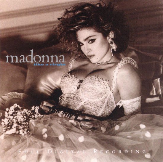 Madonna in een kanten korset en bruidssluier, met bloemen en de tekst 'madonna like a virgin'.