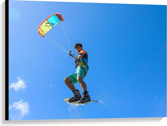 Canvas  - Kitesurfer in de Blauwe Lucht - 100x75cm Foto op Canvas Schilderij (Wanddecoratie op Canvas)