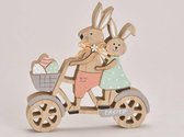 Pasen - Paasdecoratie - Houten haasjes op de fiets, jongen en meisje