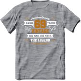 69 Jaar Legend T-Shirt | Goud - Wit | Grappig Verjaardag en Feest Cadeau Shirt | Dames - Heren - Unisex | Tshirt Kleding Kado | - Donker Grijs - Gemaleerd - S