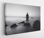 Canvas schilderij - Black and white seascape with alone man on the rocks  -     118099684 - 50*40 Horizontal