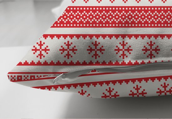Close-up van een wit en rood kerstkussen met rits en een patroon van sneeuwvlokken.