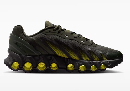 Zijaanzicht van een groene Nike Air Max Dn8 sneaker met gele luchtkussens.