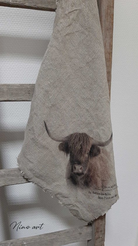 Linnen doek met afbeelding van een schotse hooglander en tekst. Afmetingen: 70x50 cm.