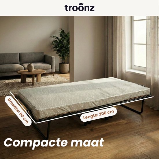 Uitgeklapt vouwbed met grijze matras, breedte 90 cm, lengte 200 cm, 'Compacte maat'.