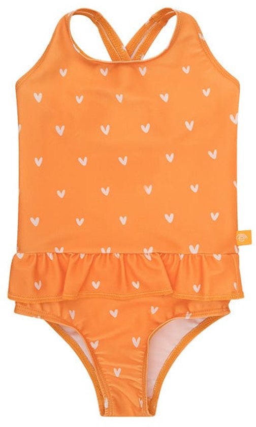Een oranje meisjesbadpak met witte hartjesprint, ruches aan de onderkant en gekruiste bandjes.