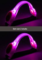 Set van 2 roze, lichtgevende hardlooparmbanden in de vorm van een gebogen strip.