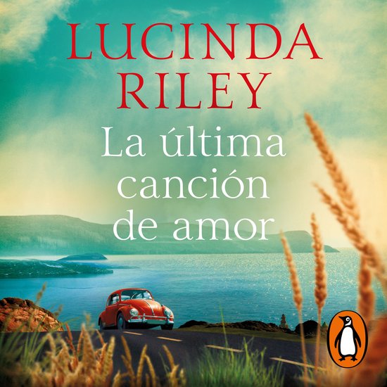 Boekcover met de titel 'La última canción de amor' van Lucinda Riley, een rode kever op een weg met uitzicht op een meer.