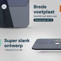 Close-up van de Sacoma weegschaal met brede voetplaat en een extra dun ontwerp van slechts 2,7 cm dik.