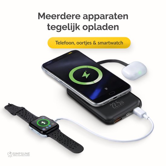 Zwarte powerbank laadt telefoon draadloos op en smartwatch via kabel.