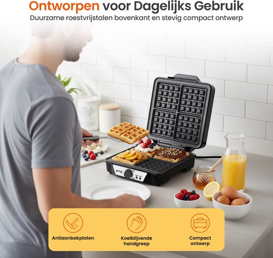 Een man bij een aanrecht met een open wafelmaker, waar vier wafels in liggen. Een deel van de wafelmaker heeft een roestvrijstalen afwerking. Ernaast liggen fruit en eieren.