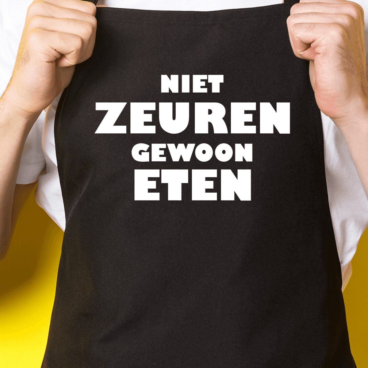 Zwart keukenschort / BBQ-schort met tekst | Niet zeuren, gewoon eten! | Katoen - One size - Verstelbaar - Wasbaar - Cadeau voor hem - Vaderdag - Gratis verzending - Cadeau voor Kerst & sinterklaas | Incl. 2 jaar garantie