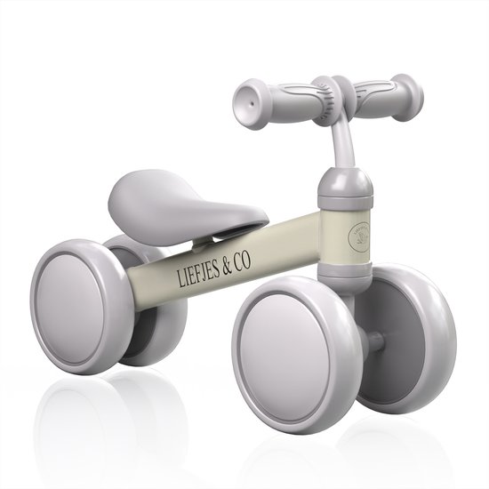 Vanille beige loopfiets met "LIEFJES & CO" op het frame.