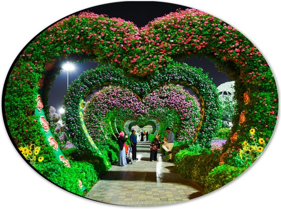 WallClassics - Dibond Ovale - Arches fleuries en forme de coeur dans un parc - 28x21 cm Photo sur ovale (avec système de suspension)