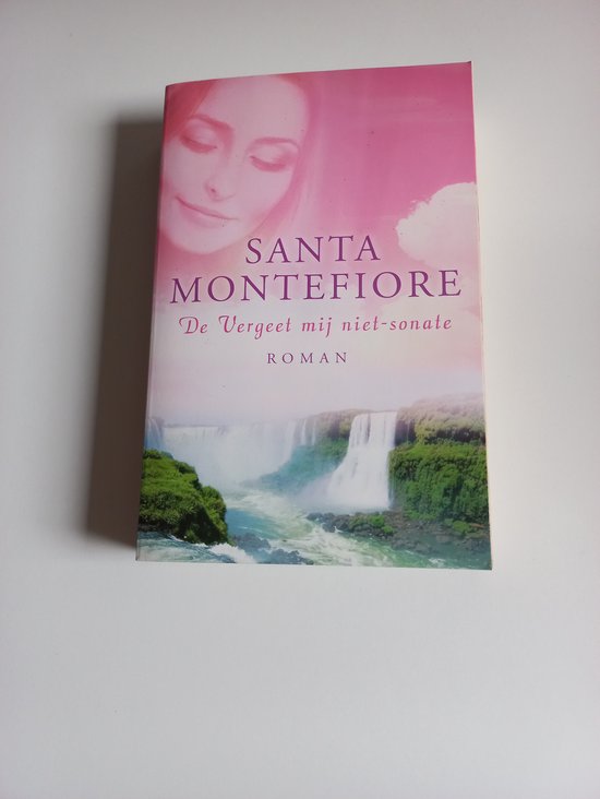 Boekomslag met roze en witte gradiënt, afbeelding van een waterval en de tekst 'SANTA MONTEFIORE De Vergeet mij niet-sonate ROMAN'.