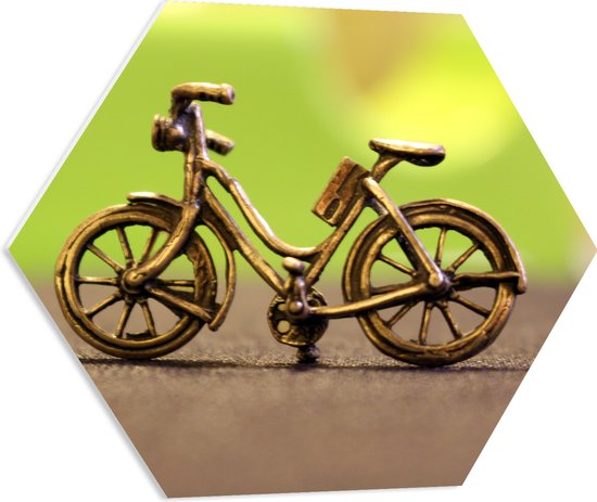 WallClassics - PVC Schuimplaat Hexagon  - Miniatuurbeeld van Gouden Fiets - 60x52.2 cm Foto op Hexagon (Met Ophangsysteem)