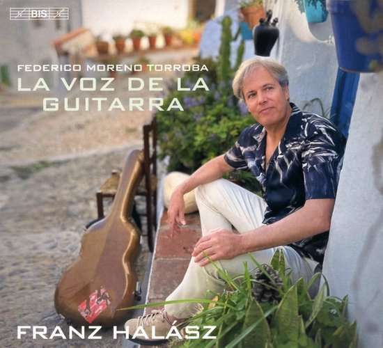 Franz Halász zittend naast een gitaarkoffer, met "FEDERICO MORENO TORROBA LA VOZ DE LA GUITARRA FRANZ HALASZ" tekst.