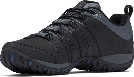 Chaussure de randonnée noire avec accents gris foncé et détails bleus sur la semelle.