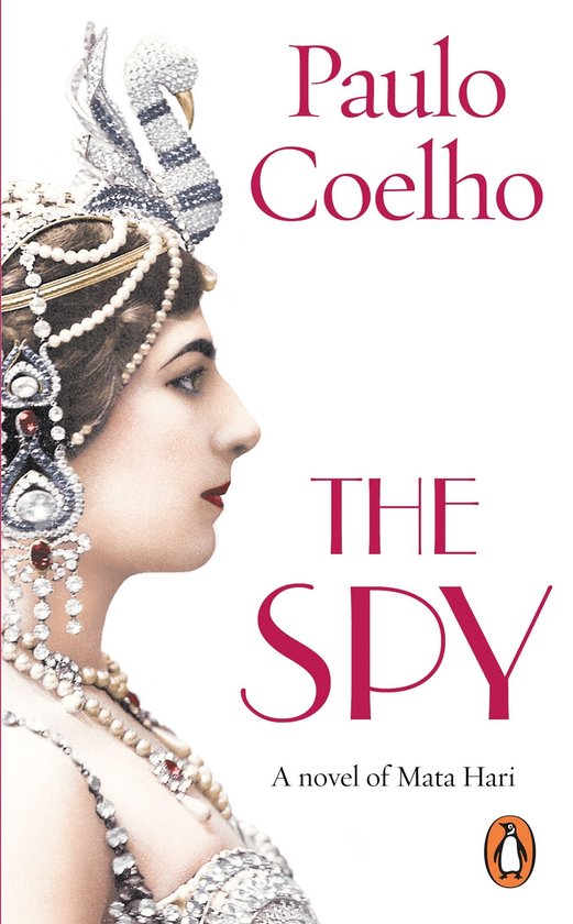 Boek "The Spy" van Paulo Coelho, met op de voorkant een portret van Mata Hari met sierlijke juwelen en hoofdbedekking.