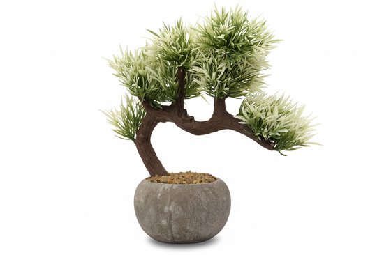 Kunst bonsai boompje met gebogen bruine stam en groen/witte bladeren, in een grijze pot met steentjes.