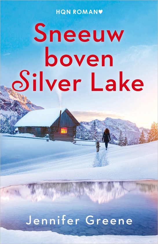 Boekomslag met de titel "Sneeuw boven Silver Lake" door Jennifer Greene, met een besneeuwd huisje, een vrouw en een hond bij een meer.