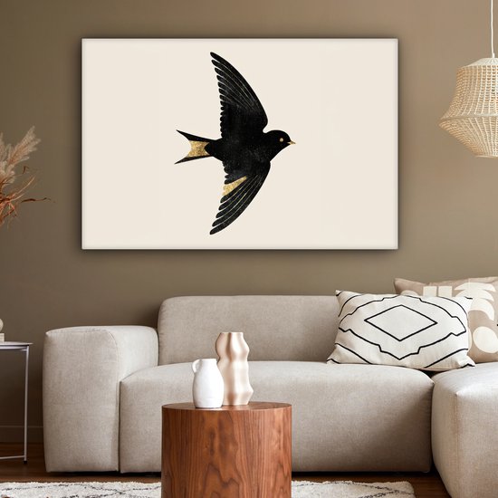 Canvas schilderij 120x80 cm - Wanddecoratie Zwarte zwaluw - Gouden accenten - Lichte achtergrond - Muurdecoratie woonkamer - Slaapkamer decoratie - Kamer accessoires - Schilderijen op canvas