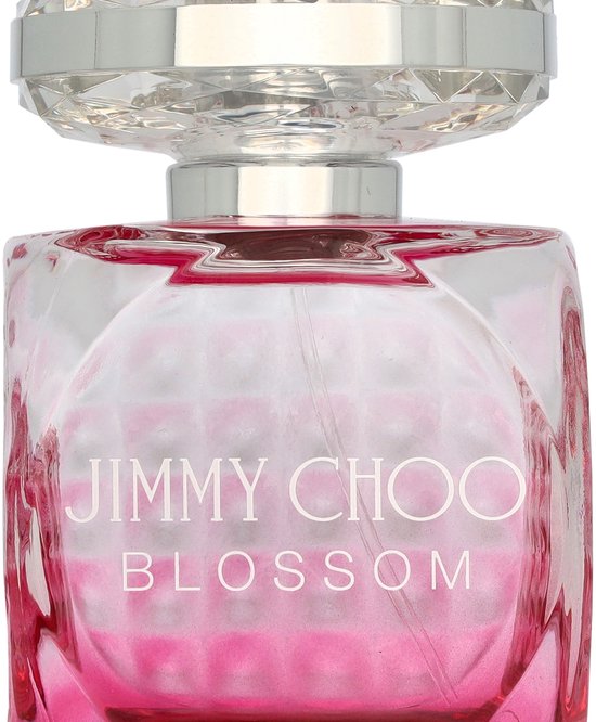 Glazen fles Jimmy Choo Blossom met roze vloeistof en facetdop.