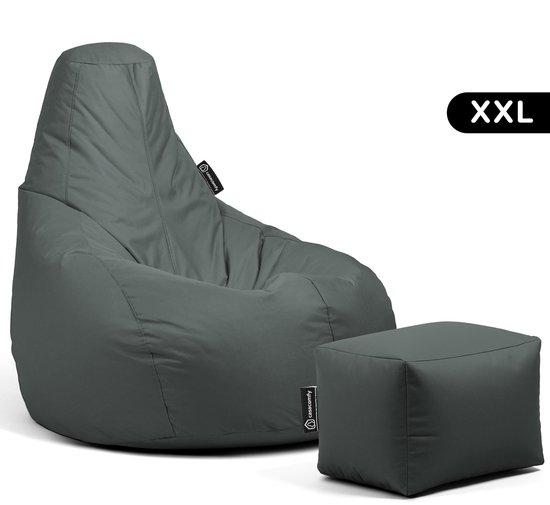 Grijze XXL zitzak met bijpassend voetenbankje.