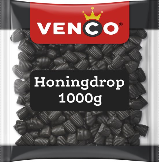 Venco honingdrop, 1000g zak met zwarte dropjes in bijenkorfvorm. Rode band met Venco logo bovenaan.