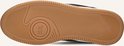 Onderkant bruine leren sneaker met "HUB" logo en rutekstuur op de zool.