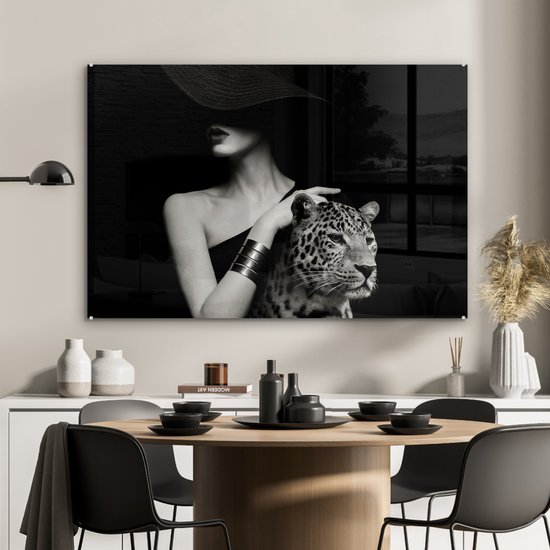 MuchoWow® Glasschilderij 120x80 cm - Schilderij acrylglas - Vrouw - Luipaard - Luxe - Zwart - Wit - Dier - Foto op glas - Muurdecoratie woonkamer - Wanddecoratie slaapkamer - Schilderijen