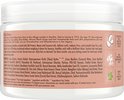 Ingrediënten en "Our Story" op de achterkant van de pot Shea Moisture Coconut & Hibiscus Curl Enhancing Smoothie.