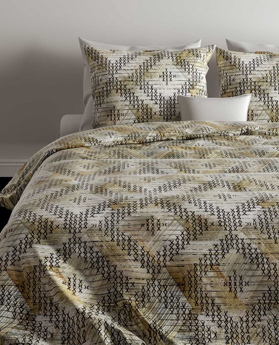 Housse de couette et taies d'oreiller avec motif géométrique vert, beige et noir. Ressemblent à un filet de pêche.