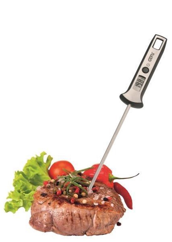 Biefstuk met kruiden en zout, met een digitale thermometer erin. Garnituur van sla en peper.