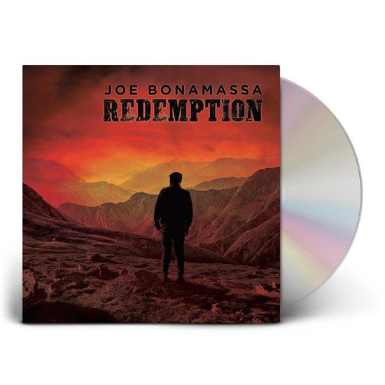 CD-hoes 'Redemption' met albumhoes en glimmende CD ernaast, tegen een witte achtergrond.