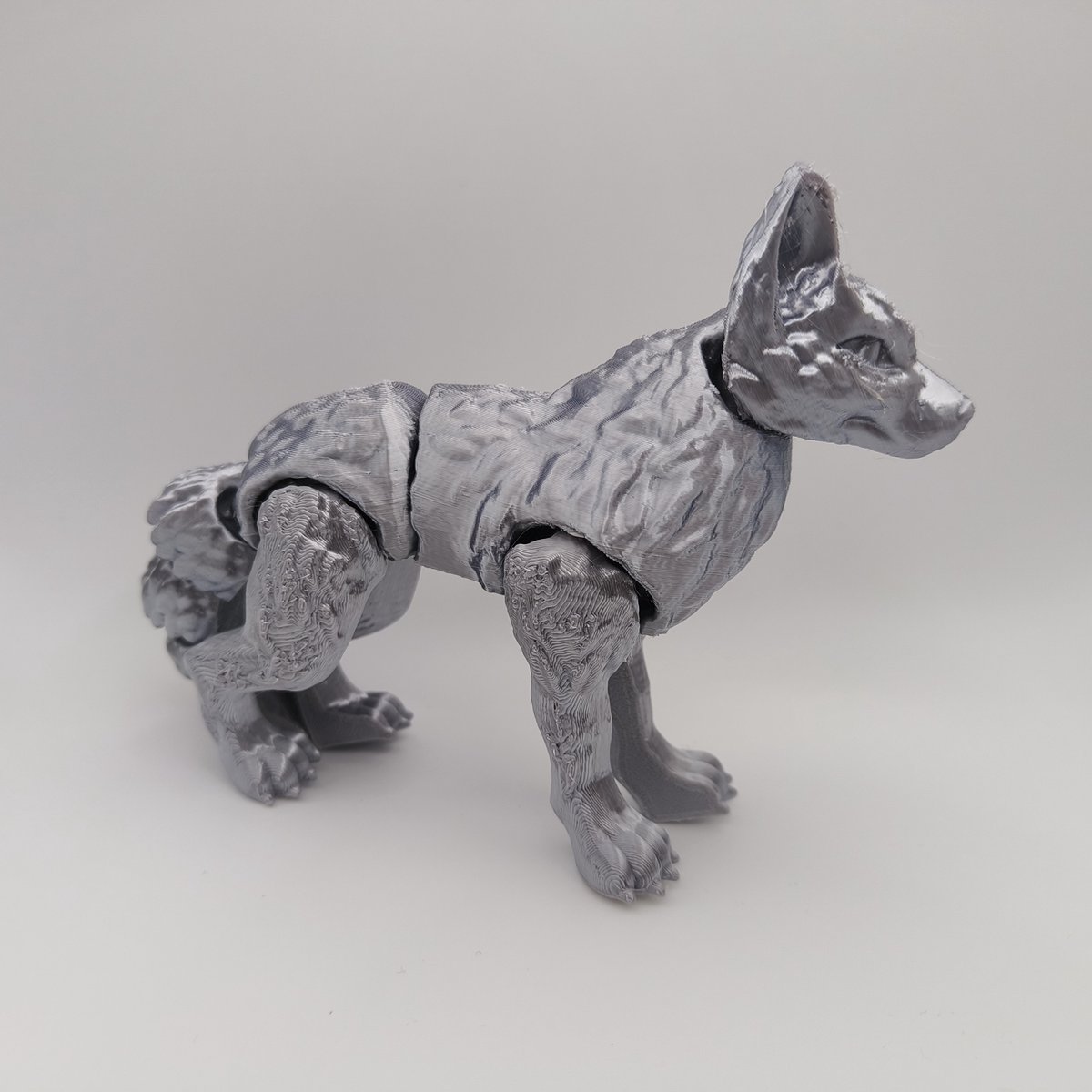 gearticuleerde wolf fidget speelgoed zilver