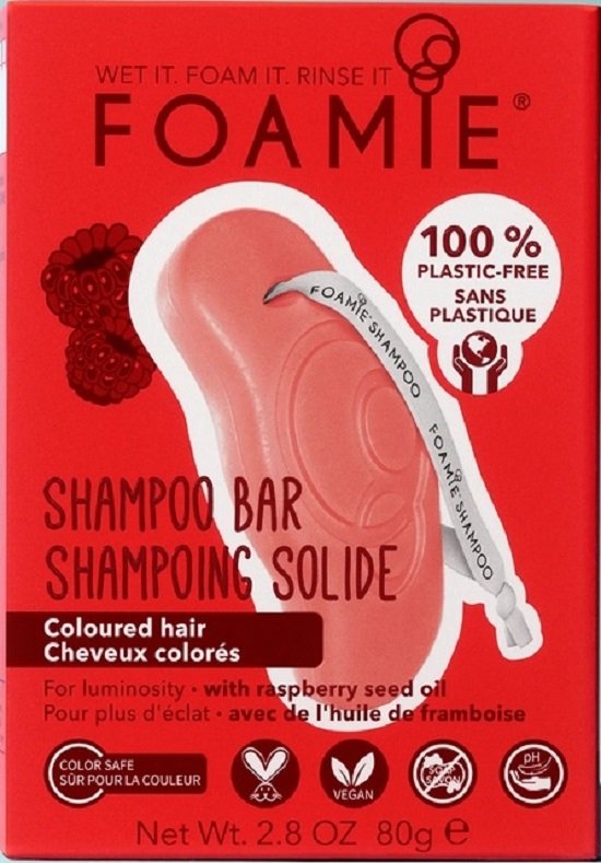 Rode verpakking voor een shampoo bar met frambozen, de tekst 'Foamie shampoo bar', en '100% plastic-free'.