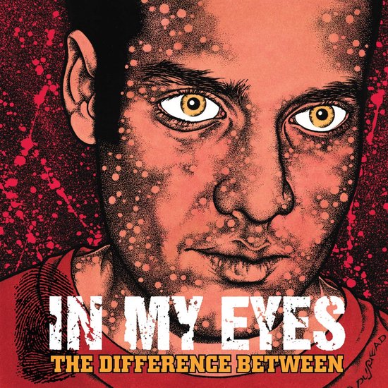 Albumcover met portret van een man met gele ogen, rood shirt en verfspatten.
