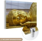MuchoWow® Glasschilderij 120x80 cm - Schilderij acrylglas - Liggende Boeddha van goud - Foto op glas - Schilderijen