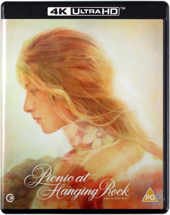 Voorkant Blu-ray hoesje. Schilderij van een blonde vrouw in profiel met golvend haar. "Picnic at Hanging Rock".