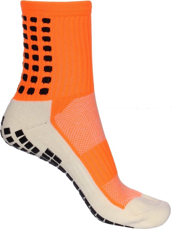 Oranje sportsok met beige hiel en tenen. Zwarte gripnoppen op de zool en hiel.